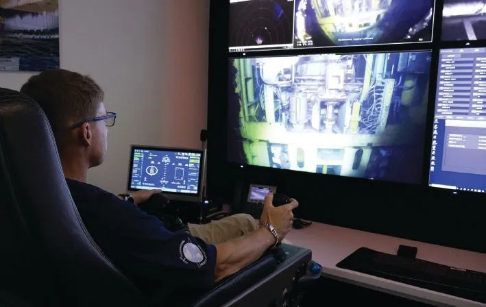 An ROV pilot conducting a remote subsea inspection task. (Credit: Oceaneering)