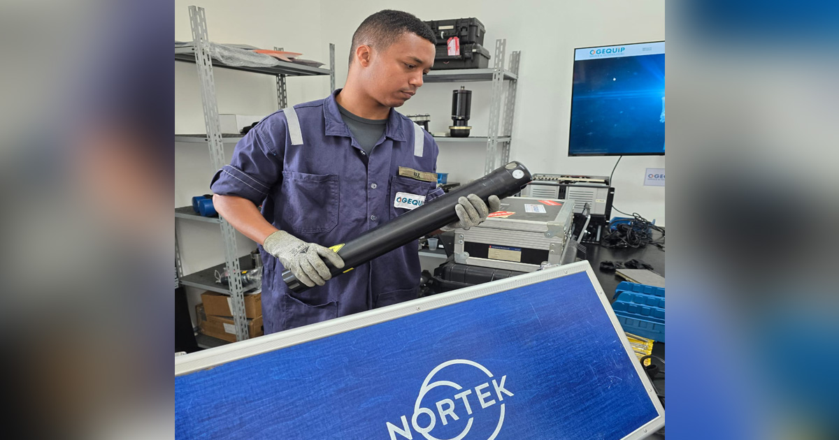 An OGEQUIP technician prepares a Nortek ADCP for service.