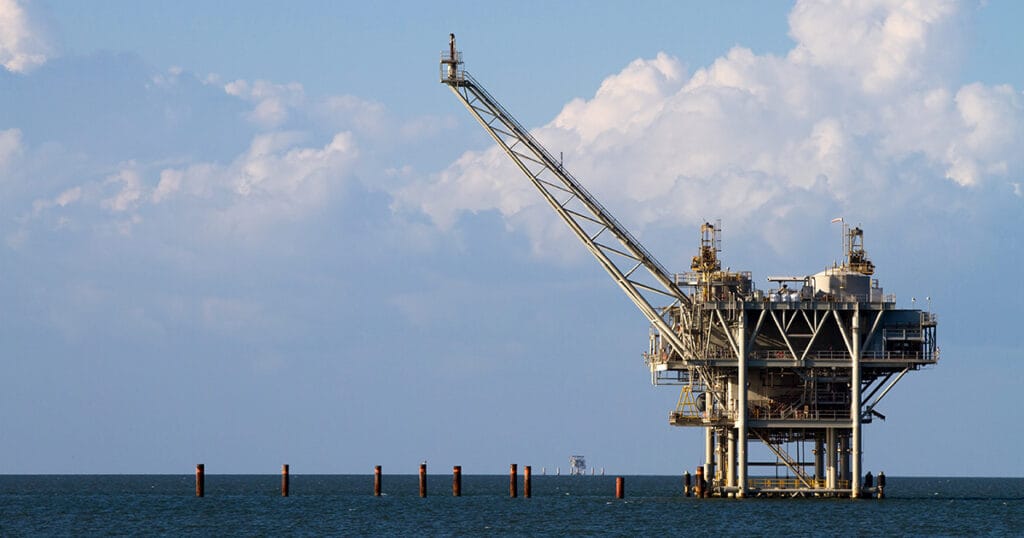 Gulf of America oil rig against a cloudy blue sky