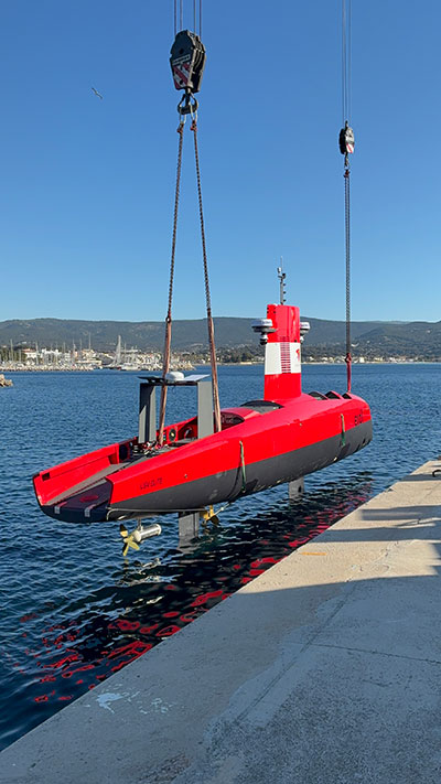 A DriX O-16 uncrewed surface vessel being deployed.