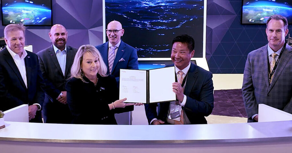 Leidos Defense President Cindy Gruensfelder, left, and Havoc Co-Founder and CEO Paul Lwin, right, signed the agreement between the two companies at Sea-Air-Space in National Harbor, MD, on April 20, 2026.