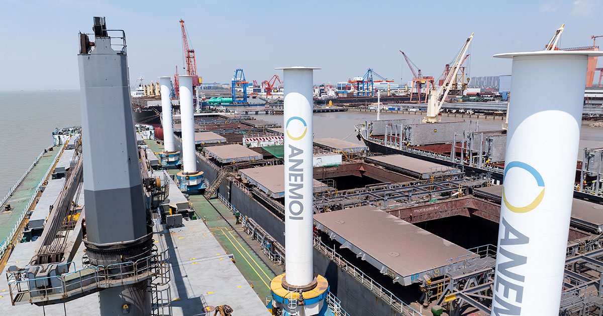 Wide view of M/V Afros in dry dock, showing the vessel’s Anemoi Rotor Sails and cargo handling areas.