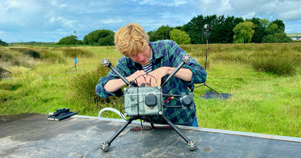 This image shows Reinhart Paelinck, CEO and Founder of Kiteswarms Ltd, preparing a drone for the DroneHome field trials that took place at Wrafton, Devon, UK.