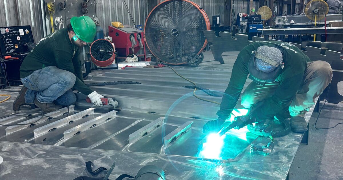 Workers at Bayou Metal Supply & Manufacturing's facility in Slidell, Louisiana, fabricate structural components for HII's ROMULUS unmanned surface vessel (USV) program.