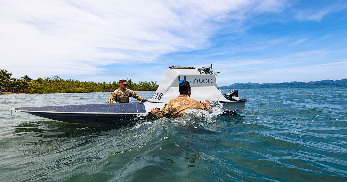 US Army Pfc. Ethan Lair (left) and Spc. Jeremiah Ortiz (right), assigned to the 125th Intelligence and Electronic Warfare Battalion, 25th Infantry Division Artillery, 25th Infantry Division, recover an unmanned surface vessel during Exercise Salaknib 2026 at Casiguran, Philippines, June 9, 2026.