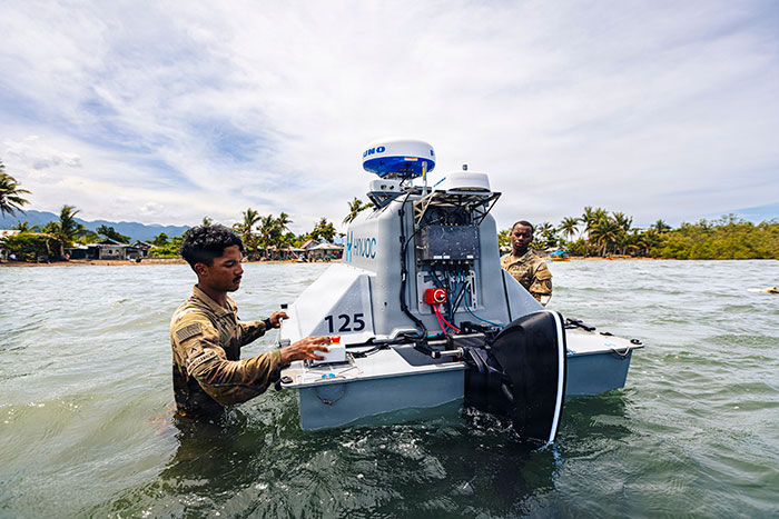 US Army PV2 Jose Martinez-Camacho (left) and Pfc. Murana Bannister (right), assigned to the 125th Intelligence and Electronic Warfare Battalion, 25th Infantry Division Artillery, 25th Infantry Division, recover an unmanned surface vessel during Exercise Salaknib 2026 at Casiguran, Philippines, June 9, 2026. 