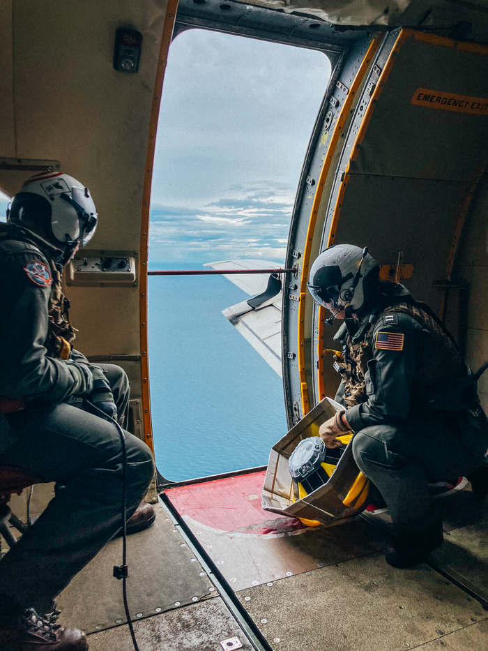 Spotter being deployed from a plane to capture real-time data from a hurricane. 