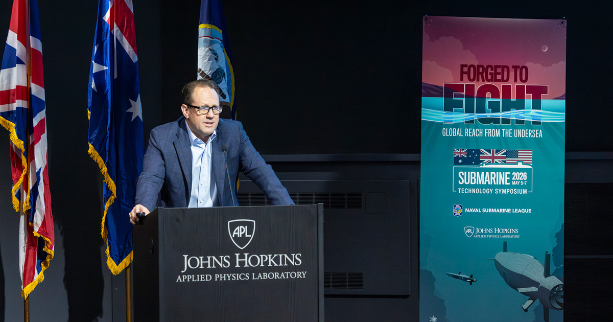 Christopher Watkins, Submarine Technology Symposium Co-Chair, welcomes attendees to the annual conference. (Image credit: Ed Whitman, Johns Hopkins APL)