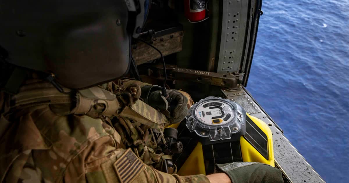 US Army Spc. Ernest Useinov, a UH-60 helicopter repairer serving as a crew chief assigned to Task Force Saber, 25th Combat Aviation Brigade, holds an ocean buoy sensor while flying over open water as part of Exercise Balikatan 2026 over the Luzon Strait, Philippines, April 28, 2026. (Image credit: Sgt. Olivia Cowart, US Army, The appearance of US Department of War (DoW) visual information does not imply or constitute DoW endorsement)