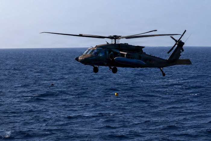 A US Army UH-60 Black Hawk helicopter assigned to Task Force Saber, 25th Combat Aviation Brigade deploys an ocean buoy sensor while flying over open water as part of Exercise Balikatan 2026 over the Luzon Strait, Philippines, April 28, 2026. (Image credit: Sgt. Olivia Cowart, US Army, The appearance of US Department of War (DoW) visual information does not imply or constitute DoW endorsement)