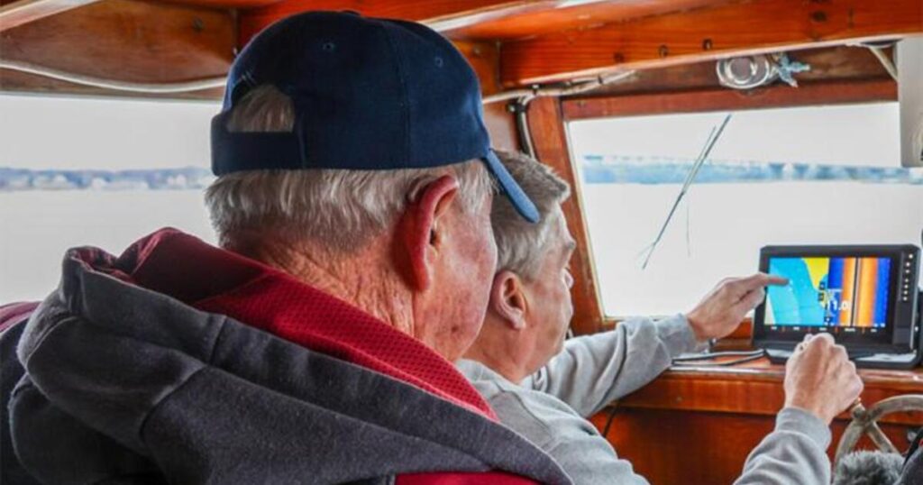 E.C. Hogg (front) and Ralph Bonniville (back) are TRAP participants who gather bathymetric data.