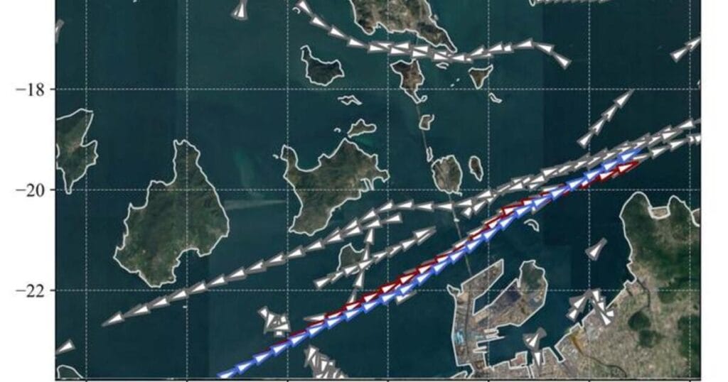 The AI-generated route (blue) closely follows the course taken by an experienced captain (red) while safely navigating through surrounding ship traffic (gray).