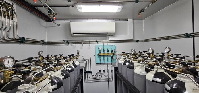 High-pressure air cylinder bank inside a Unique Group air diving system container. (Image credit: Unique Group)