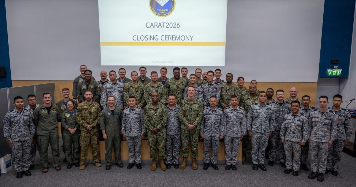 Service members from US Navy, USCG, Royal Canadian Navy, and Royal Thai Navy at the closing ceremony of CARAT Thailand 2026.