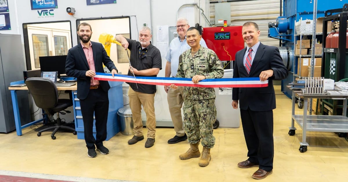 Figure 1: Pictured left to right, Troy Pierson, Director, MADMAN Repair Center, Scott Gamble, Mechanical and Materials Rapid Prototype Branch Manager, Jeff Campbell, NAVSEA 05T1, Cold Spray Project Manager, Capt. Boonyobhas, NSWC Crane Commanding Officer, and Dr. Werner, NSWC Crane Deputy Technical Director.