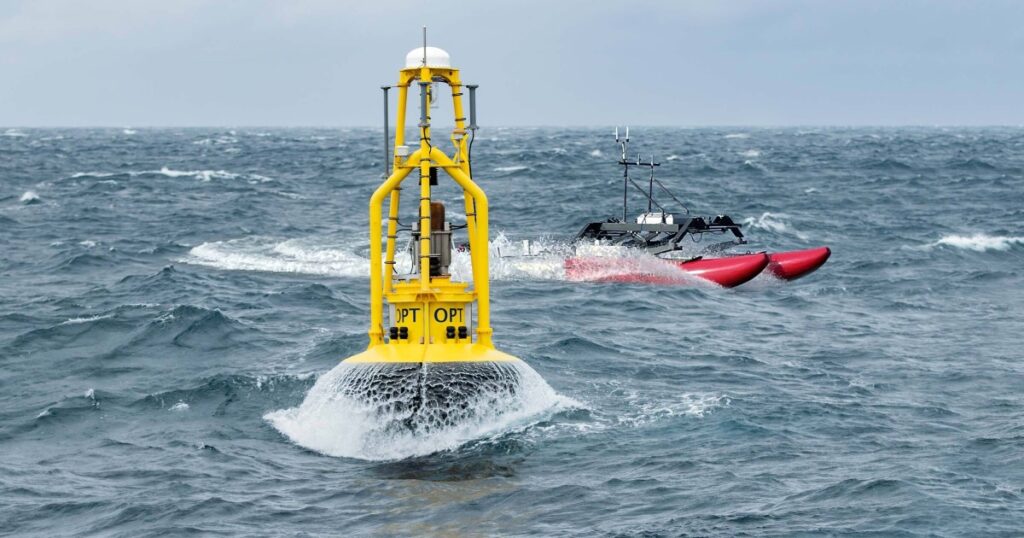 A WAM-V USV circling an OPT PowerBuoy. (Credit: OPT)