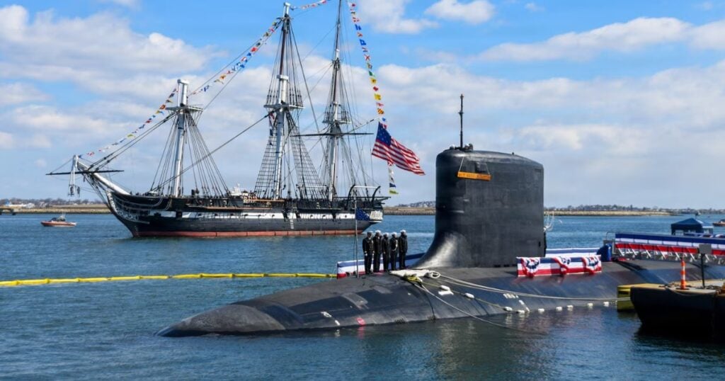 The USS Constitution sails past the Virginia-class nuclear-powered fast-attack submarine USS Massachusetts (SSN 798) during Massachusetts’ commissioning in Boston, on March 28th, 2026. Massachusetts is the newest fast-attack submarine and the fifth US Navy vessel to bear the name. (Image credit: Mass Communication Specialist 2nd Class Lucas J. Hastings, US Navy)