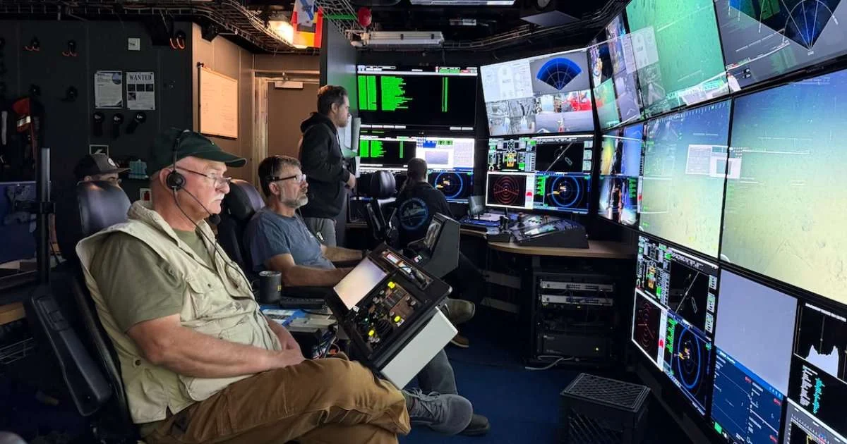 MBARI and NOAA scientists, including onboard collaborator Andrew DeVogelaere (left), were surveying the seafloor near Davidson Seamount when they caught a fleeting glimpse of a bigfin squid ( Magnapinna_ sp.). (Image credit: Olívia Soares Pereira, MBARI)