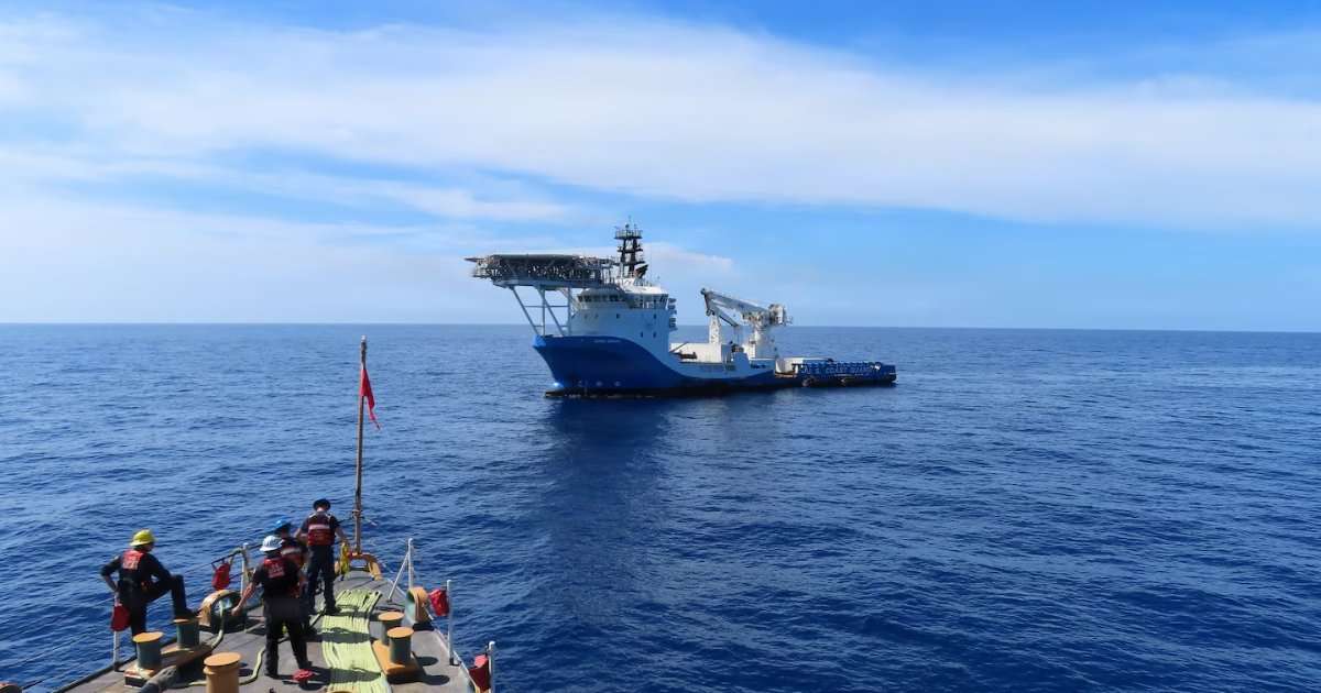 A Coast Guard Cutter Escanaba (WMEC 907) small boat crew approaches a suspected smuggling vessel in the Caribbean Sea, Aug. 29, 2026. The tactical boarding and search of the vessel resulted in the seizure of approximately 2,082 pounds of marijuana, valued at more than $2.4 million. (Image credit: Petty Officer 2nd Class Nadia Sands, US Coast Guard)