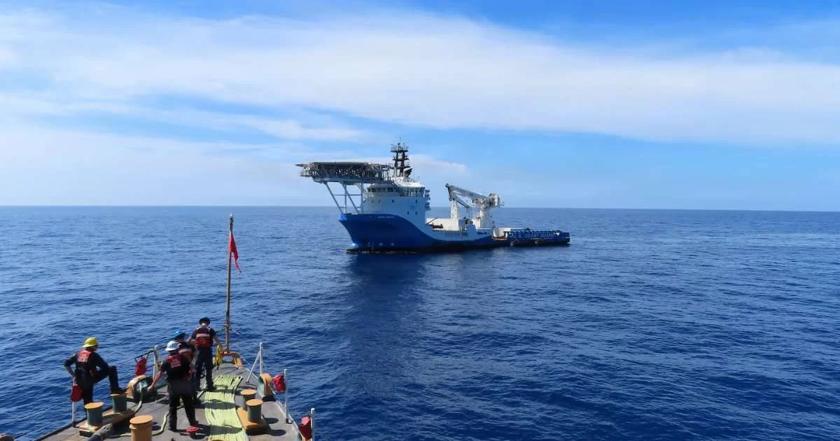 A Coast Guard Cutter Escanaba (WMEC 907) small boat crew approaches a suspected smuggling vessel in the Caribbean Sea, Aug. 29, 2026. The tactical boarding and search of the vessel resulted in the seizure of approximately 2,082 pounds of marijuana, valued at more than $2.4 million. (Image credit: Petty Officer 2nd Class Nadia Sands, US Coast Guard)