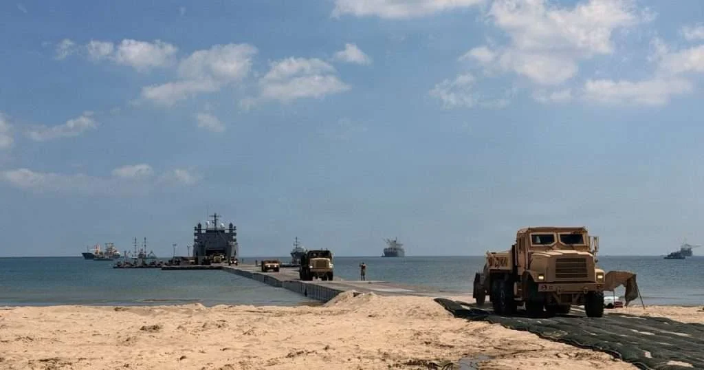 A US Army temporary pier system enables shiptoshore offloading and provides a mooring point for US Coast Guard Port Security Unit 309’s 32foot Transportable Port Security Boats at Yeongil Bay, Pohang, South Korea, during Combined Joint Logistics OvertheShore (CJLOTS) 26, July 13, 2026. Conducted under the 1953 ROKUS Mutual Defense Treaty, CJLOTS 26 strengthens the Alliance’s commitment to regional peace and security. (Image credit: Lt. Ashlee Stephens, US Coast Guard)