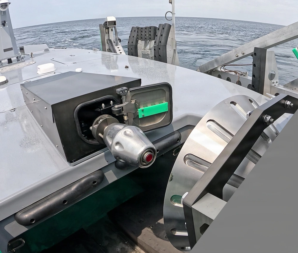 A refueling probe on the T38 unmanned surface vessel, left, prepares to mate with a towable capture and connection device, right, during an Aug. 11 refueling demonstration off Joint Expeditionary Base Little Creek-Fort Story, Virginia. (Image credit: Naval Air Warfare Center Weapons Division)
