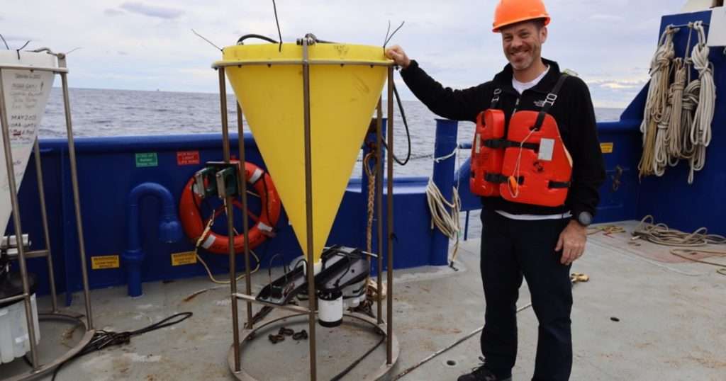 Luke Thompson, Ph.D., a researcher with the Northern Gulf Institute, collects samples of forams from a sediment trap aboard the R/V Pelican in November 2023 as part of a larger collaborative effort with the US Geological Society (USGS) to examine marine snow and what microscopic life are comprising the biological carbon pump in the Gulf of America. (Credit: Northern Gulf Institute)