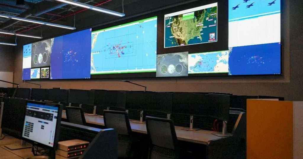 Displays show simulated monitoring views of systems used to conduct training at U.S. Fleet Forces Command’s John “Bag” Hefti Global Live, Virtual and Constructive Operations Center during the facility's opening day at Naval Air Station Oceana Dam Neck Annex, Virginia Beach, Va., May 14, 2024. Utilized and maintained by technical agent Naval Surface Warfare Center Corona Division, the operations center specializes in live, virtual, constructive training, which combines real-world, in-person elements with virtual reality, simulation and other computer-generated technologies to enable service members to train like they fight. (Image credit: Neil Mabini, US Navy)