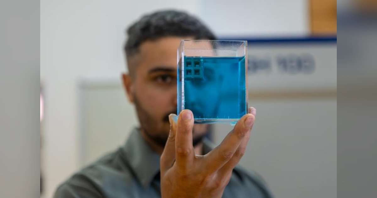 Dr. Jordan Noronha holding a sample of the floating titanium. Credit: Sara Tan, RMIT. (Image credit: Sara Tan, RMIT)