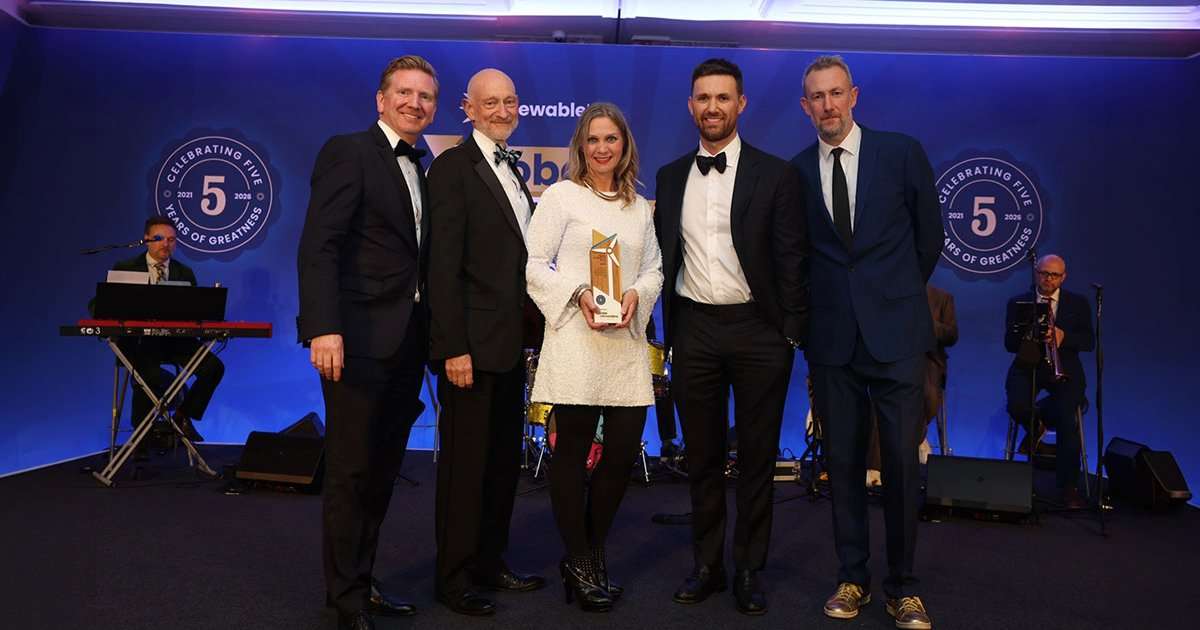 Pictured (left to right) are Dan McGrail, presenter of the award; Benj Sykes of Ørsted; Paula and Dean from OEG; and host Alex Horne at the Global Offshore Wind Awards ceremony. (Credit: Ørsted/OEG)